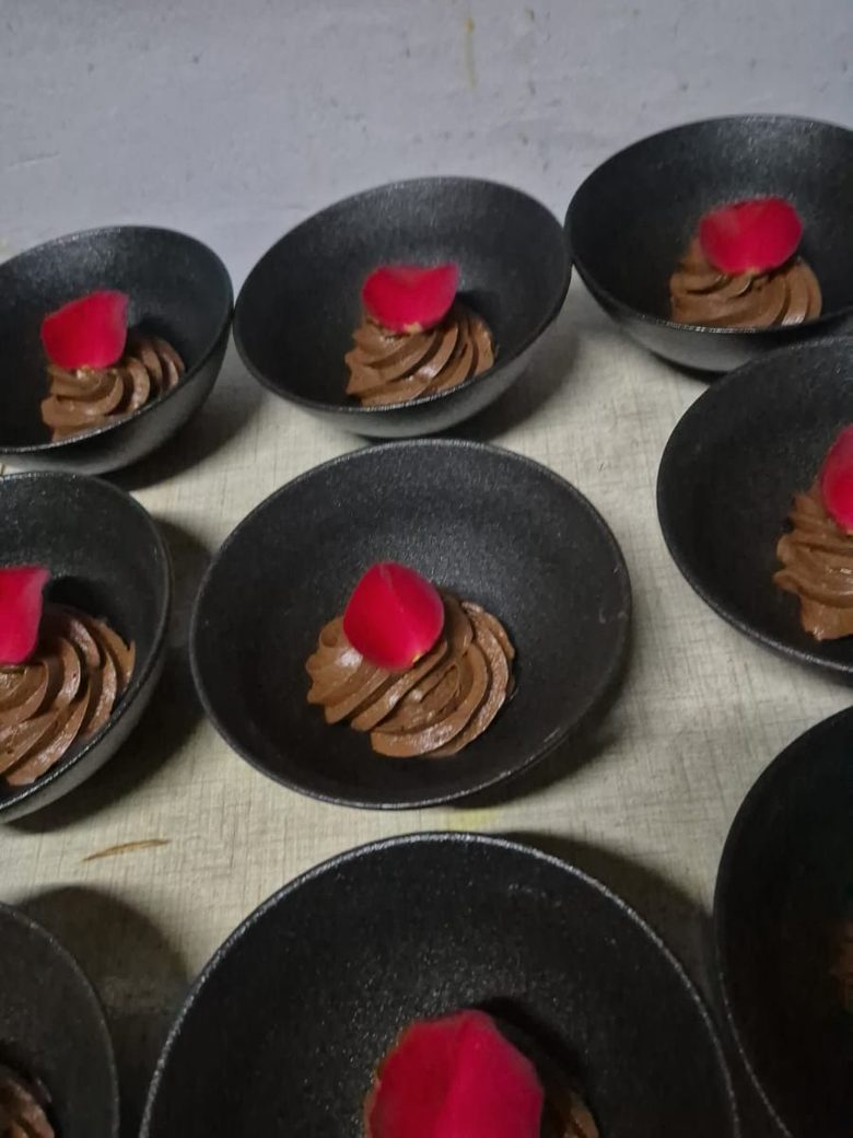 Chocolate mousse desserts plated in a row by King Protea Services