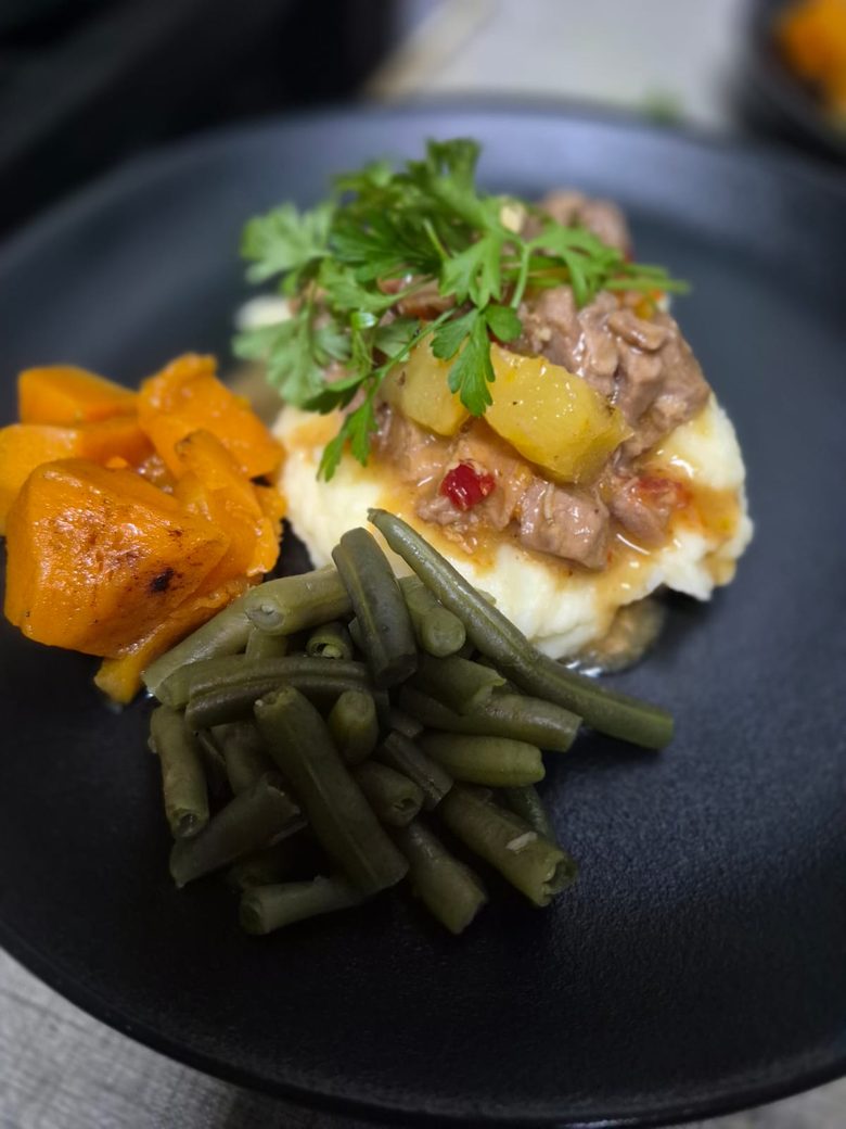 Plated mains prepared for a managed canteen service